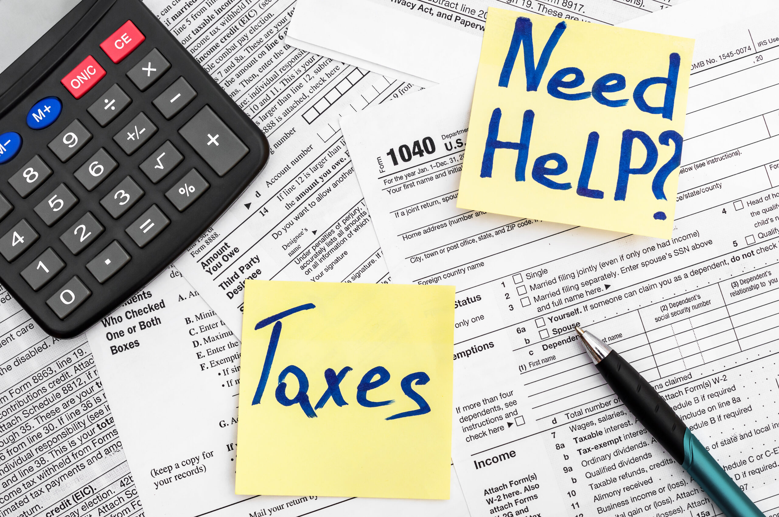 Need,Help,And,Taxes,Text,On,Stickers,With,Tax,Forms.